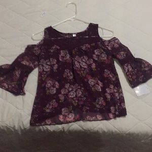 A nice shirt with flowers , a nice design